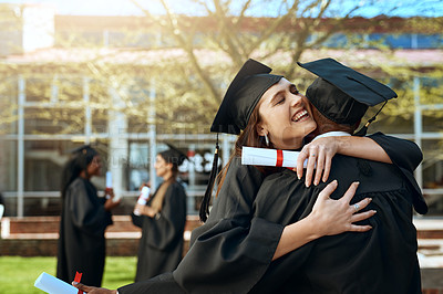 Buy stock photo Shot of a happy young man and woman hugging on graduation day