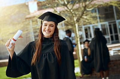 Buy stock photo Graduation, portrait and happy woman with degree at university, success or achievement in Australia. Female student, smile and proud with diploma for goal, certificate or award on campus for ceremony