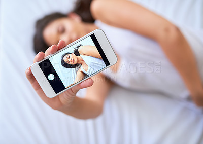 Buy stock photo Cellphone screen, selfie and woman on bed in home for relaxing, calm and resting in morning on weekend. Comfy, tech and female person with photography app for picture on phone in bedroom at house.