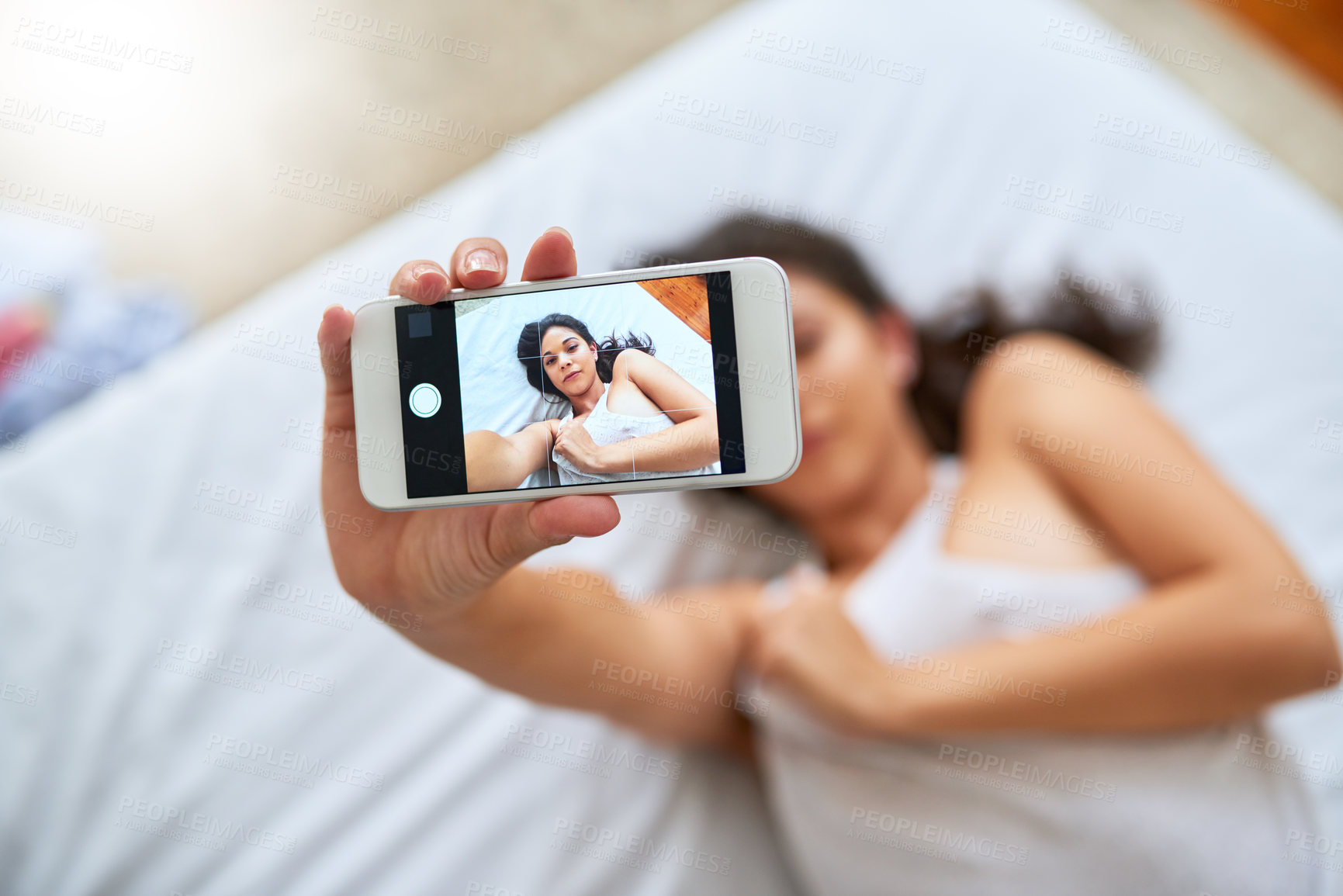 Buy stock photo Phone screen, selfie and woman in bedroom in home for relaxing, calm and resting in morning on weekend. Comfy, tech and female person with photography app for picture on smartphone on bed at house.