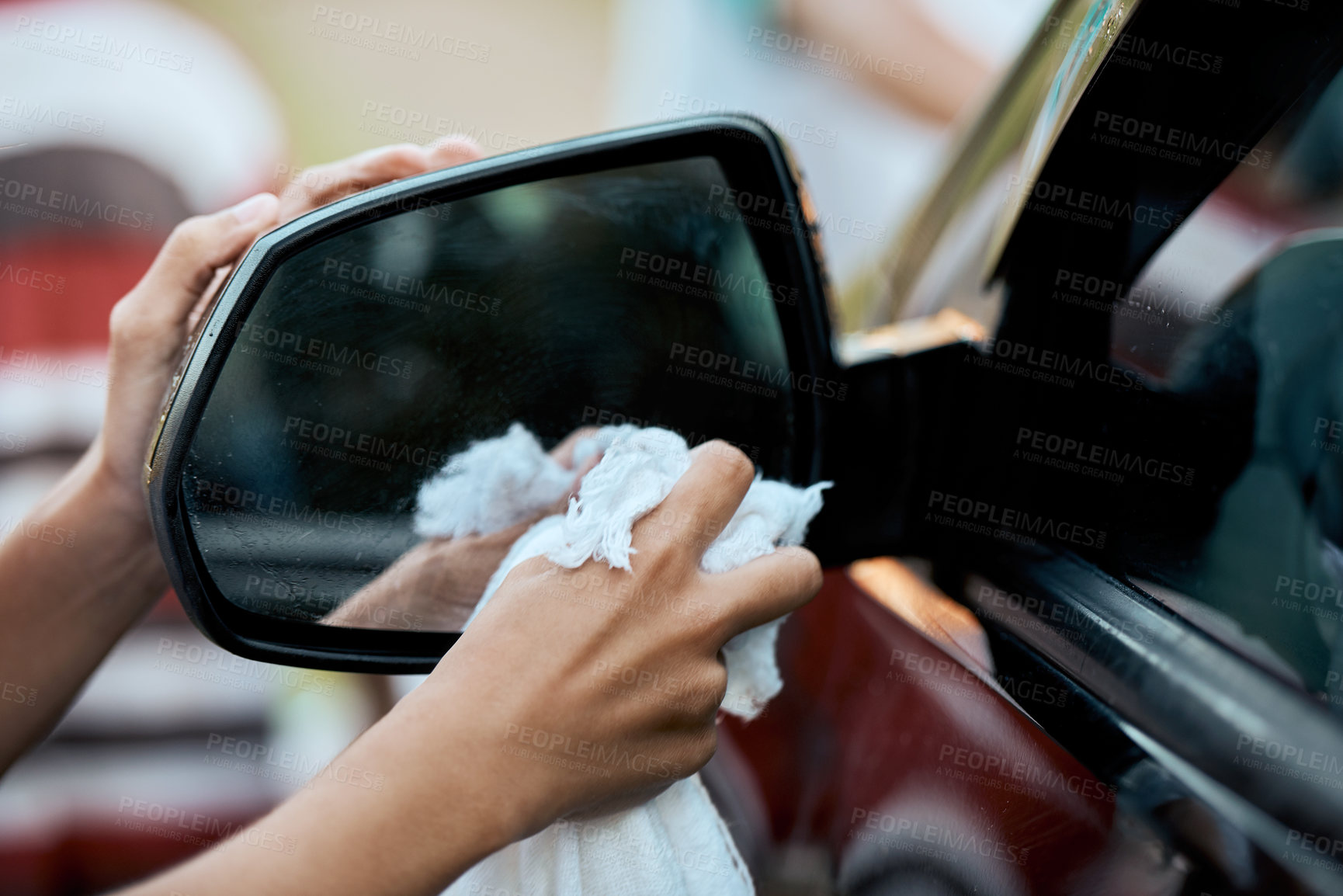 Buy stock photo Shot of an unrecognizable young child washing their parent's car outside during the day