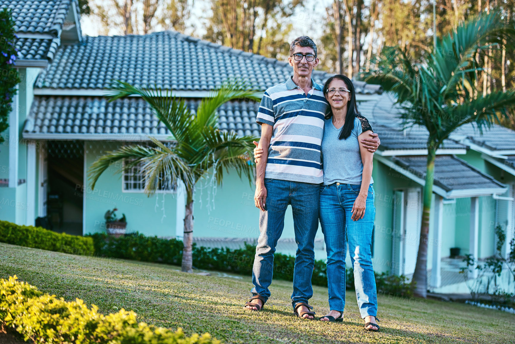 Buy stock photo Portrait, woman and man in backyard as new home or real estate investment for happy couple on lawn. Mature people and bonding in garden on property together with love, care and support in Philippines