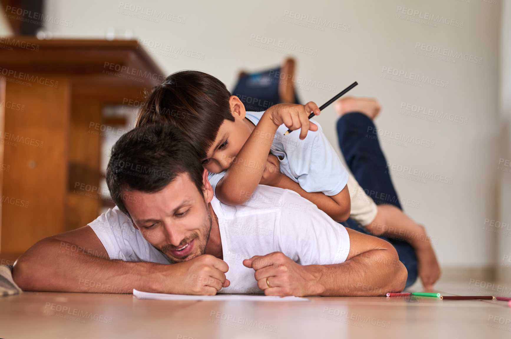Buy stock photo Full length shot of a father playing with son on the floor at home