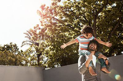 Buy stock photo Happy dad, kid and bonding with piggyback at backyard for love, freedom or holiday together at home. Father with child, son or little boy on shoulder for fun flying or enjoying weekend in nature