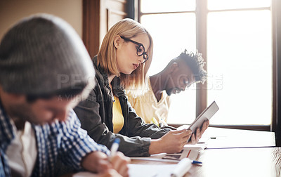 Buy stock photo Cropped shot of university students in class