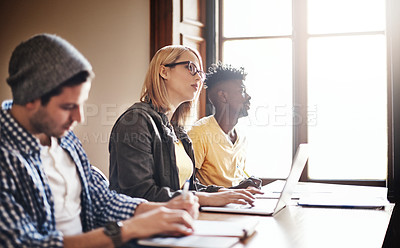 Buy stock photo Cropped shot of university students in class