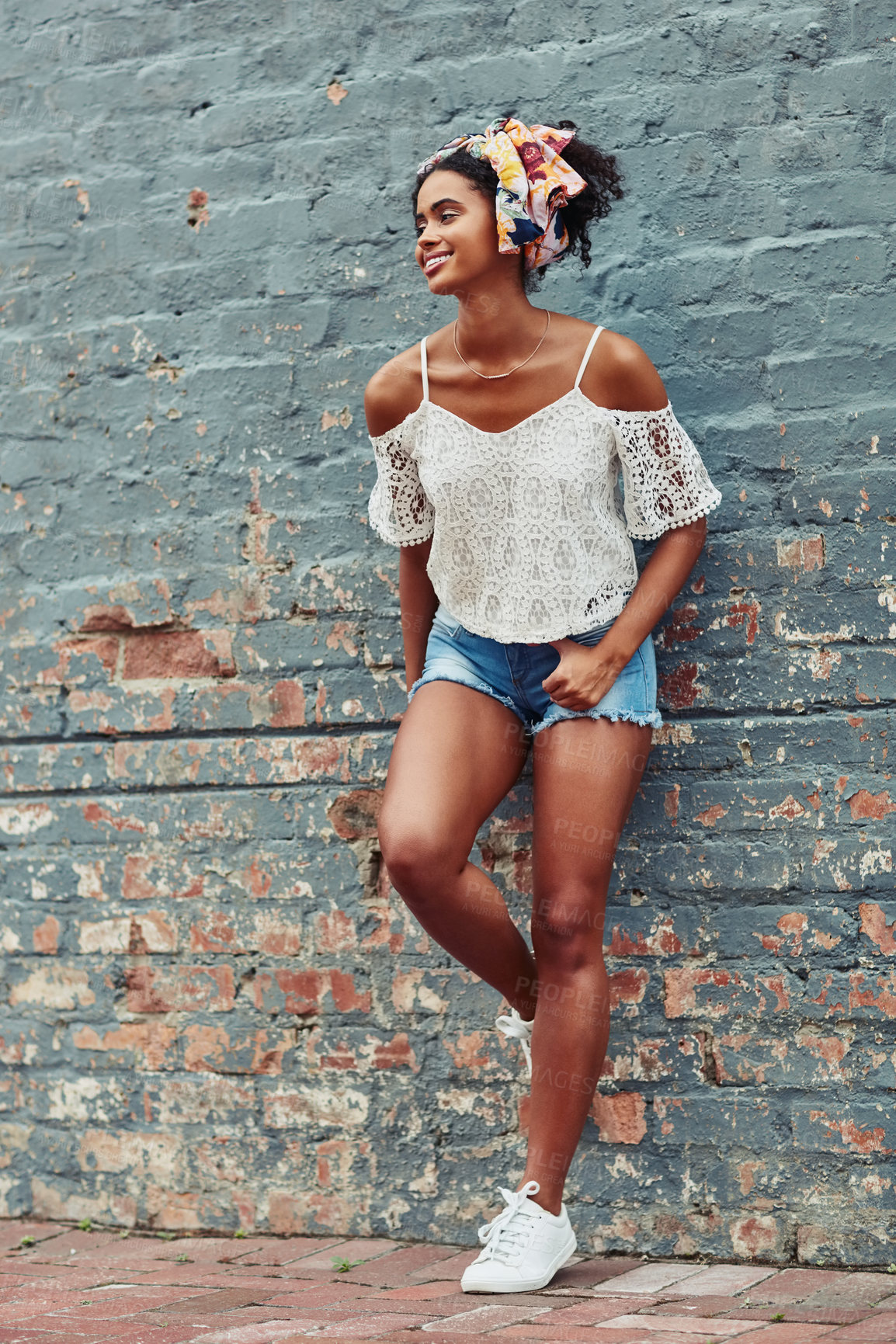 Buy stock photo Smile, thinking and woman on brick wall for fashion, style and vision in city outdoor. African girl, background and happy in streetwear for summer season, urban clothes and idea for outfit on holiday