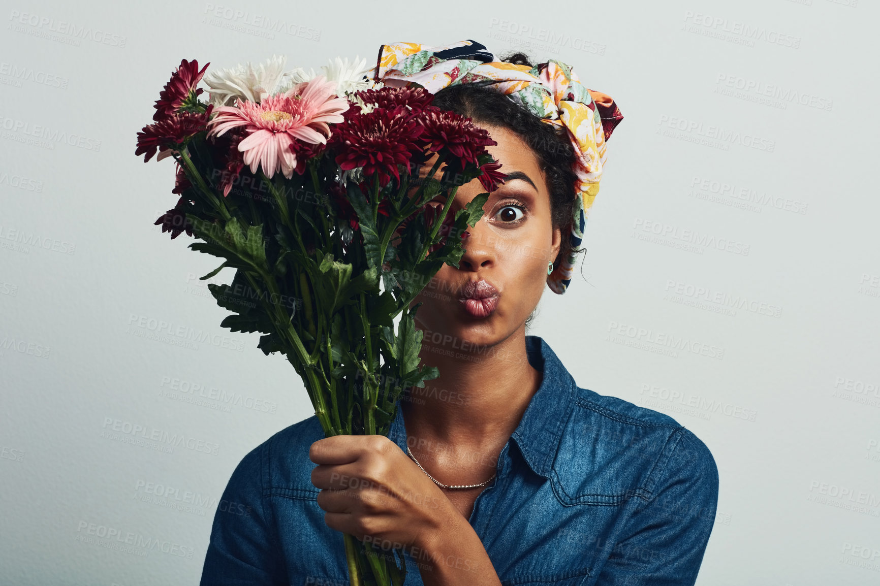 Buy stock photo Pout, flowers and smell with woman in studio for gift, satisfaction and spring fashion. Portrait, happy and trendy floral present with model and bouquet isolated on gray background for natural aroma