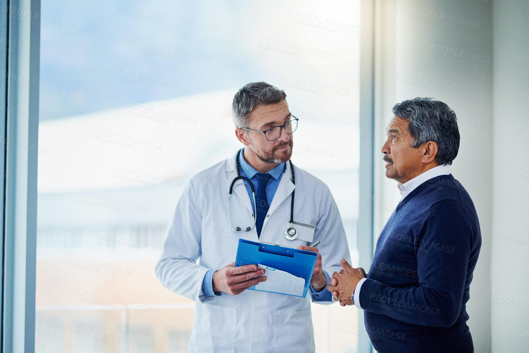Buy stock photo Consultation, medical and doctor talking to patient and writing notes on a clipboard for diagnosis in a clinic. Medicine, healthcare and professional man consulting person with health insurance