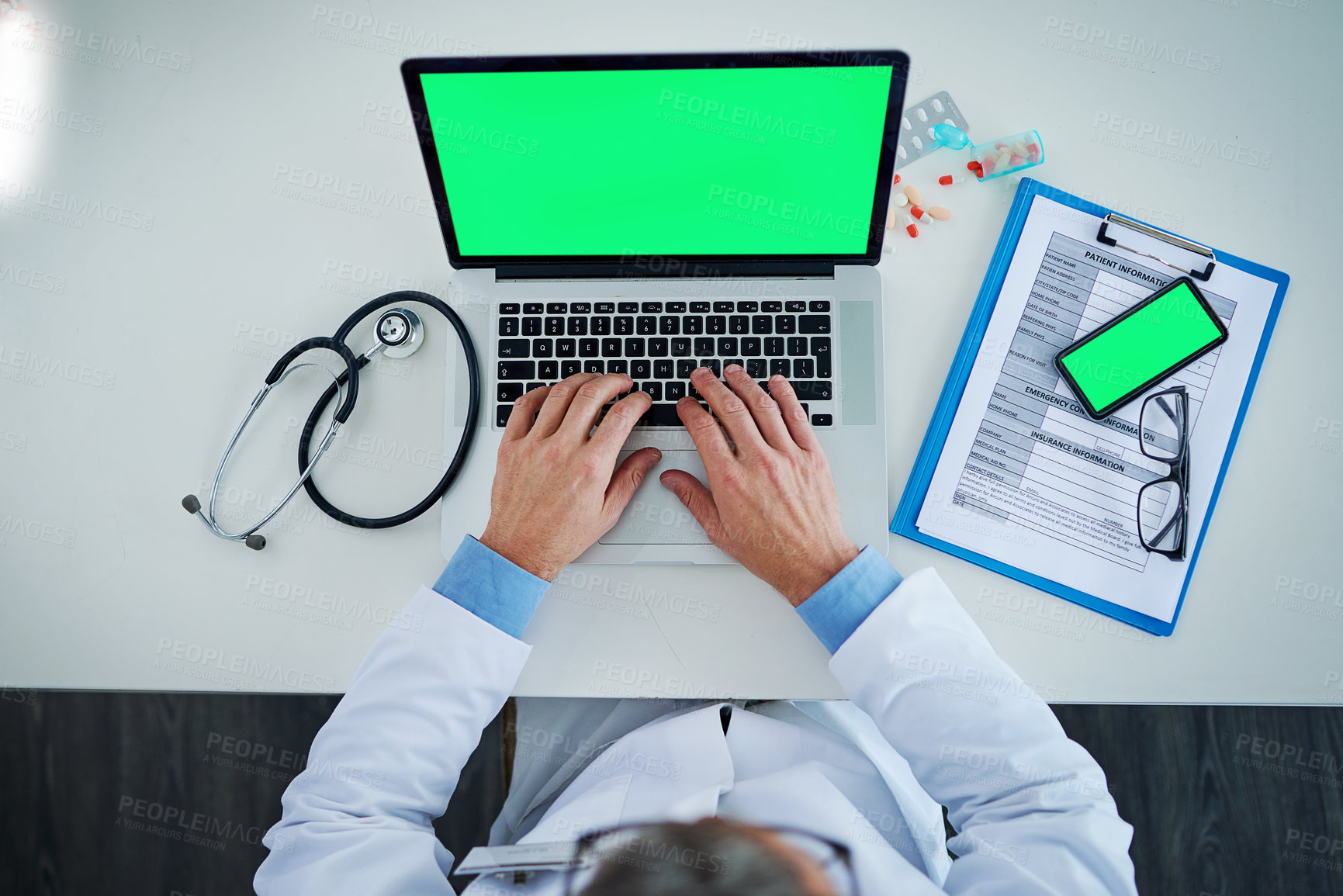 Buy stock photo Laptop, green screen and doctor hands with medicine, documents or healthcare service, research and mockup above. Space, telehealth and pills with medical person typing, phone mock up and computer app