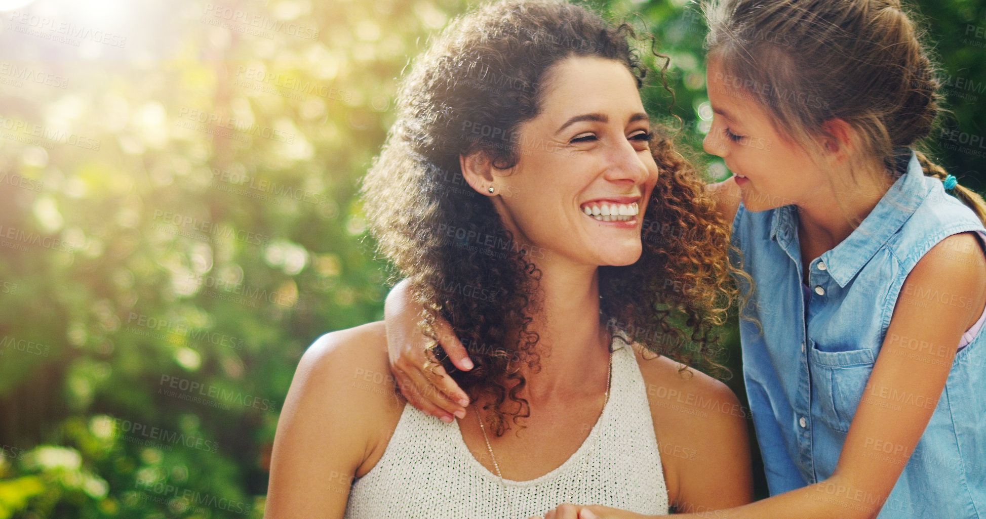 Buy stock photo Shot of an affectionate little girl spending quality time with her mother outdoors