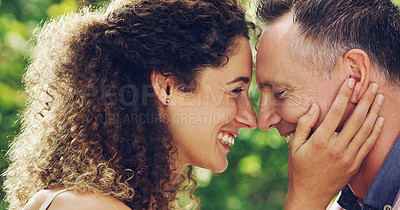 Buy stock photo Shot of a happy and affectionate mature couple spending quality time together outdoors