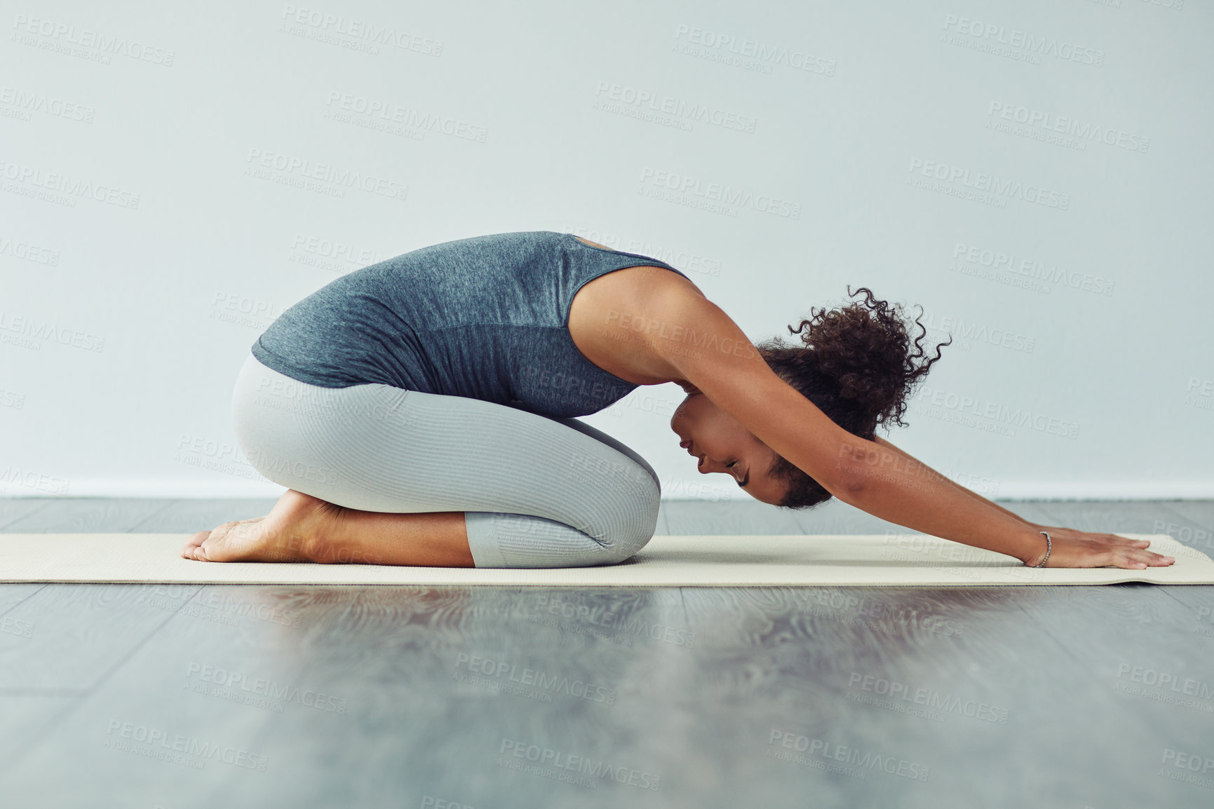 Buy stock photo Yoga, child pose and woman stretching on mat for wellness, workout and fitness in gym studio. Healthy body, meditation and female person doing pilates exercise for balance, flexibility and wellbeing