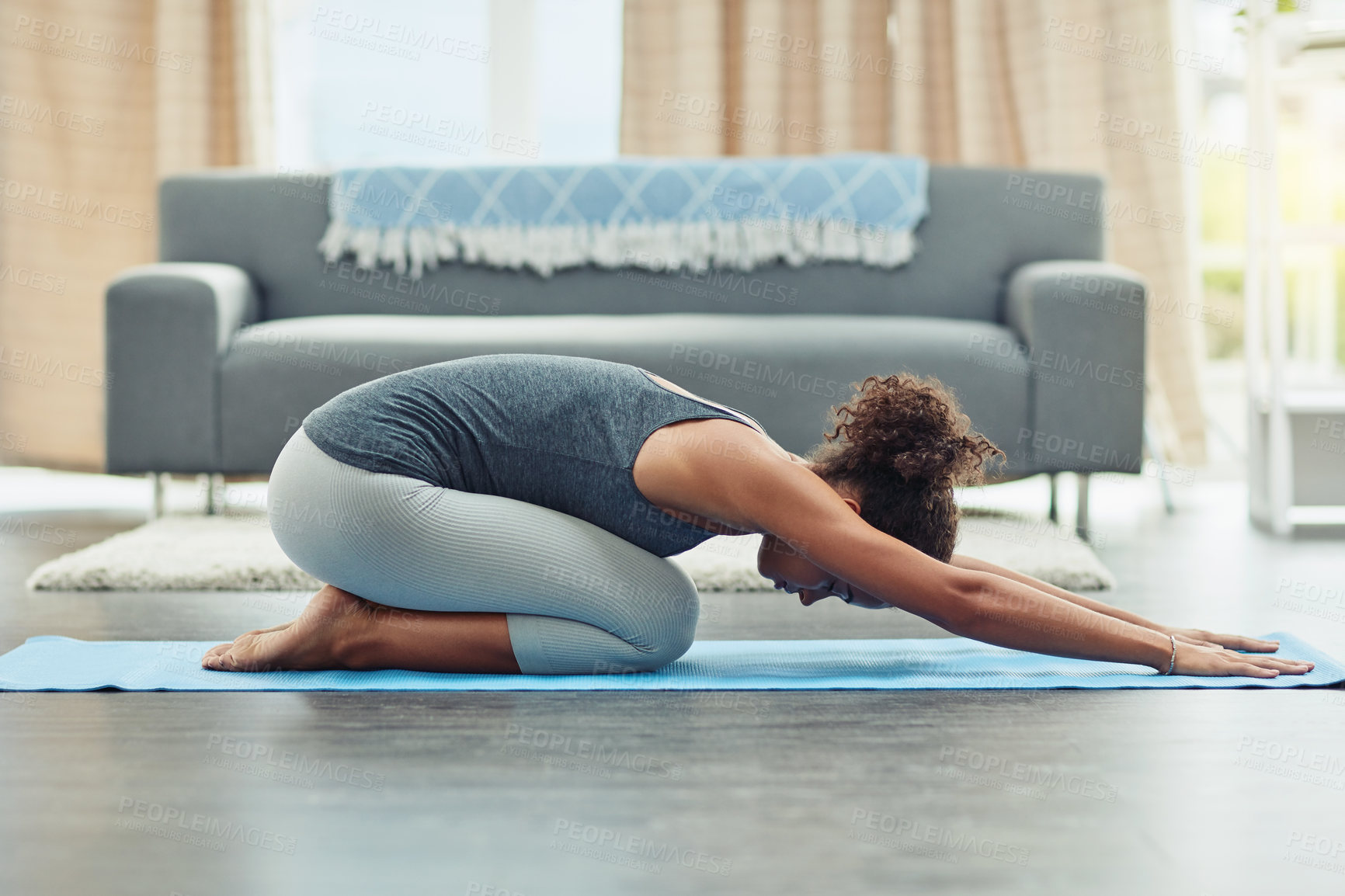 Buy stock photo Child pose, yoga and woman stretching in home for wellness, workout and fitness in living room. Healthy body, meditation and female person do pilates exercise for balance, flexibility and wellbeing