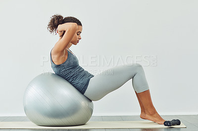 Buy stock photo Ball, exercise and sit up with woman in studio on white background for core strength, wellness or workout. Fitness, training and profile of person with equipment for balance, health or stability