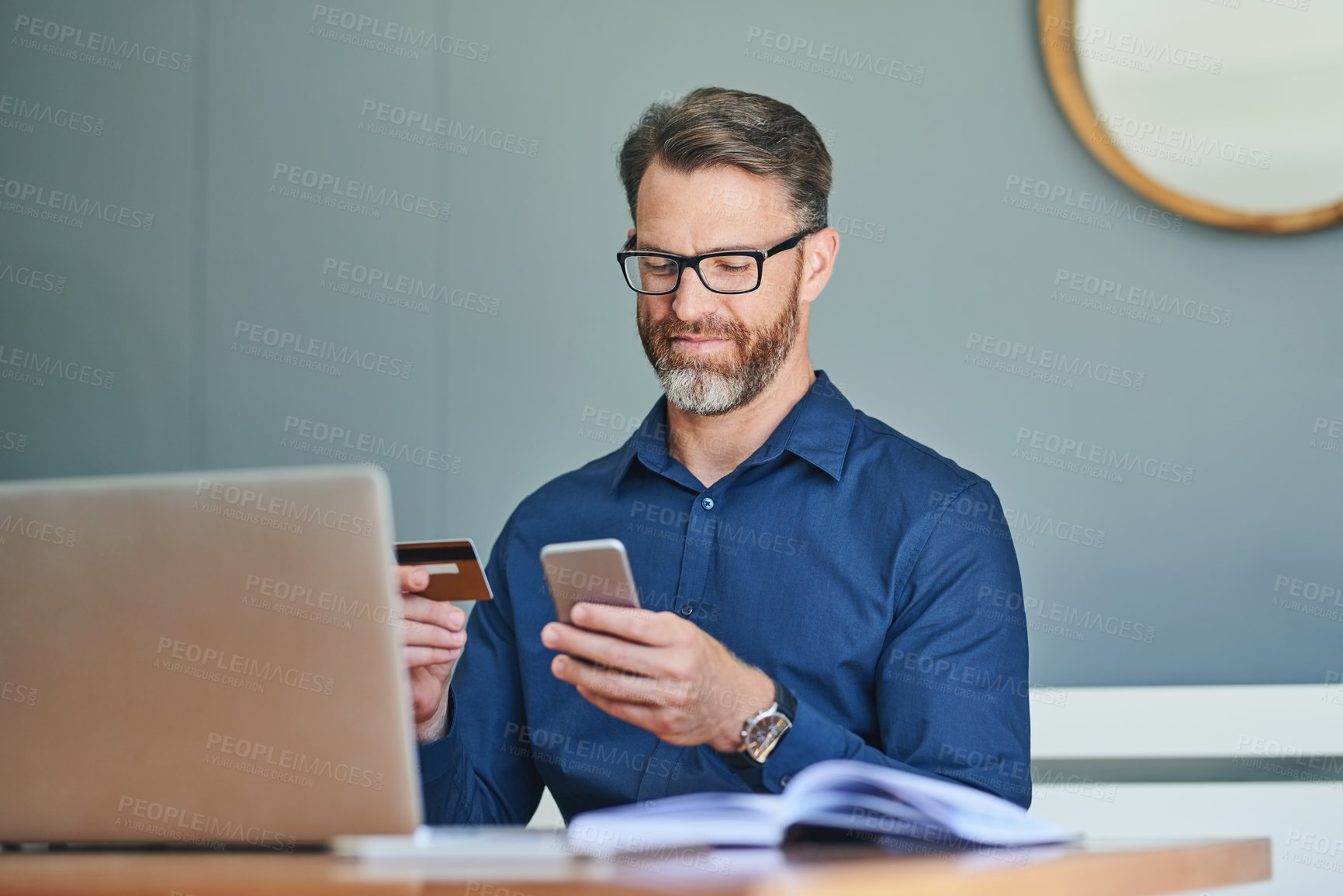 Buy stock photo Businessman, credit card and phone for ecommerce, digital and bills for trading, company and glasses in office. Laptop, online and purchase for stock market and payment with mobile, budget and website