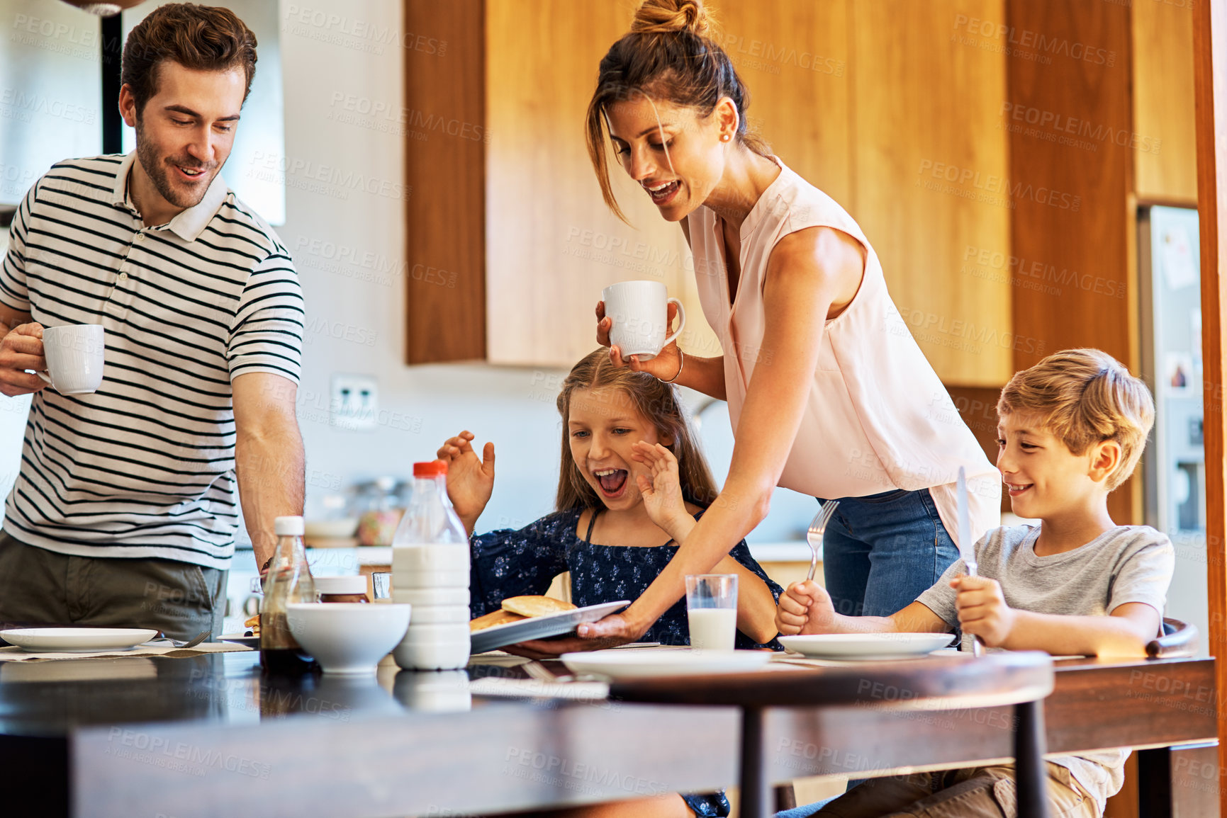 Buy stock photo Shot of a family having breakfast together at home