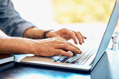 Buy stock photo Closeup shot of an unrecognizable man using a laptop at home