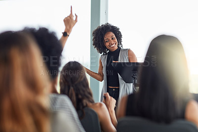 Buy stock photo Cropped shot of an attractive young businesswoman speaking at a business conference