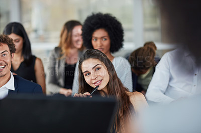 Buy stock photo Cropped shot of an attractive young businesswoman looking thoughtful while attending a seminar