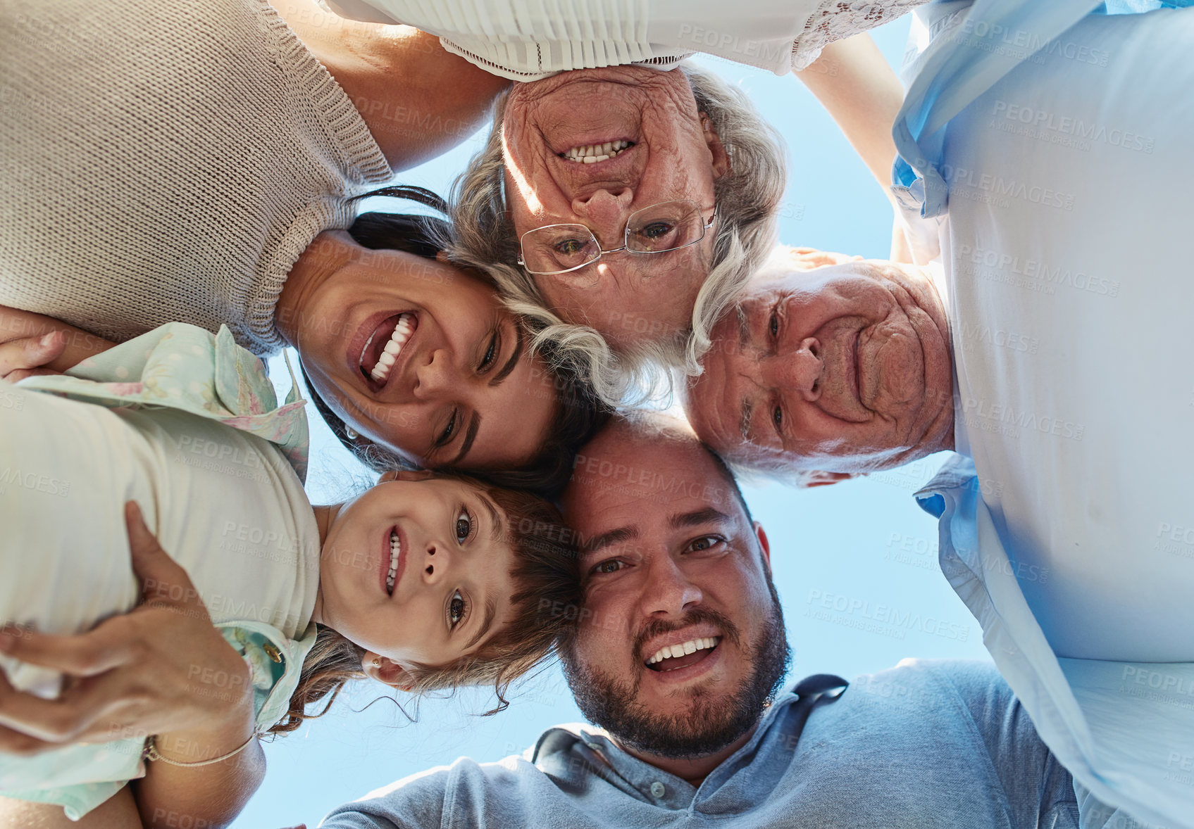 Buy stock photo Portrait, family and huddle together outdoor for love, support and bonding with generations. Face, father and mother with grandparents, child and happy people laughing below for connection in USA