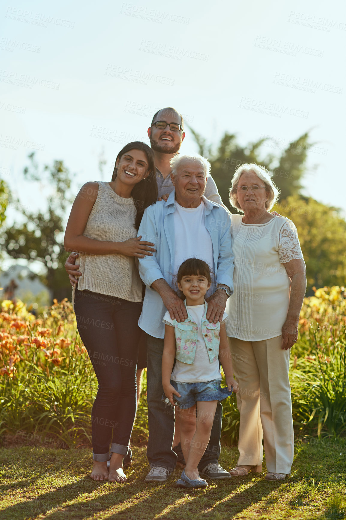 Buy stock photo Portrait, happy family and generations outdoor together for love, support and bonding with girl. Smile, father and mother with grandparents, child and people laugh in nature for vacation in Mexico