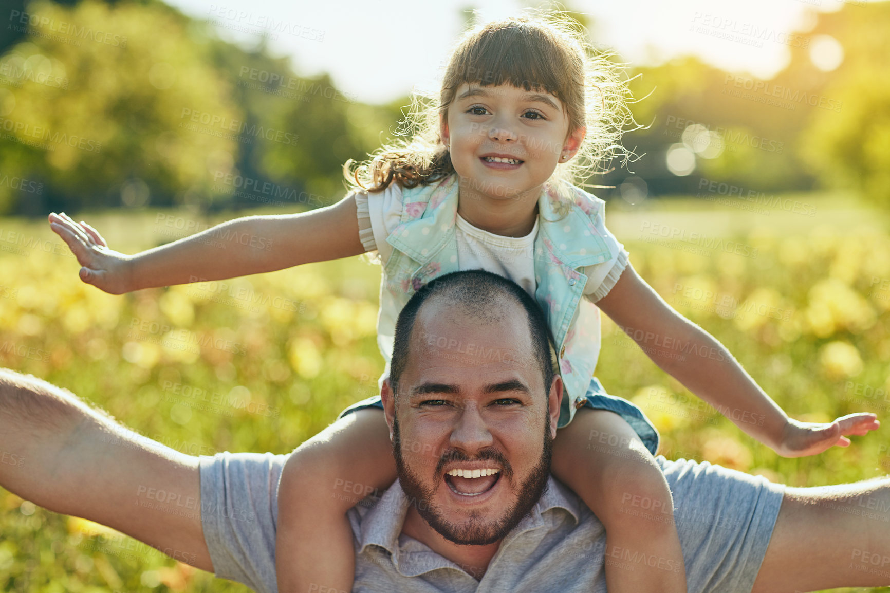 Buy stock photo Shot of an adorable little girl and her father playing together in the park