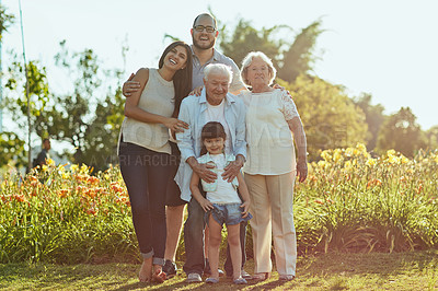 Buy stock photo Shot of a happy family of three generations spending quality time together in the park