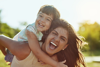 Buy stock photo Laughing, mother and girl with piggyback in park, connection and bonding together with smile. Family, mom and child with carrying for playful, support and happiness on vacation outdoor in Spain