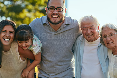 Buy stock photo Shot of a happy family of three generations spending quality time together in the park