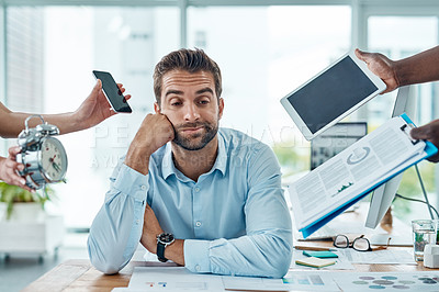 Buy stock photo Portrait of a young businessman looking stressed out in a demanding office environment
