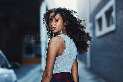 Buy stock photo Shot of an attractive young woman in the city