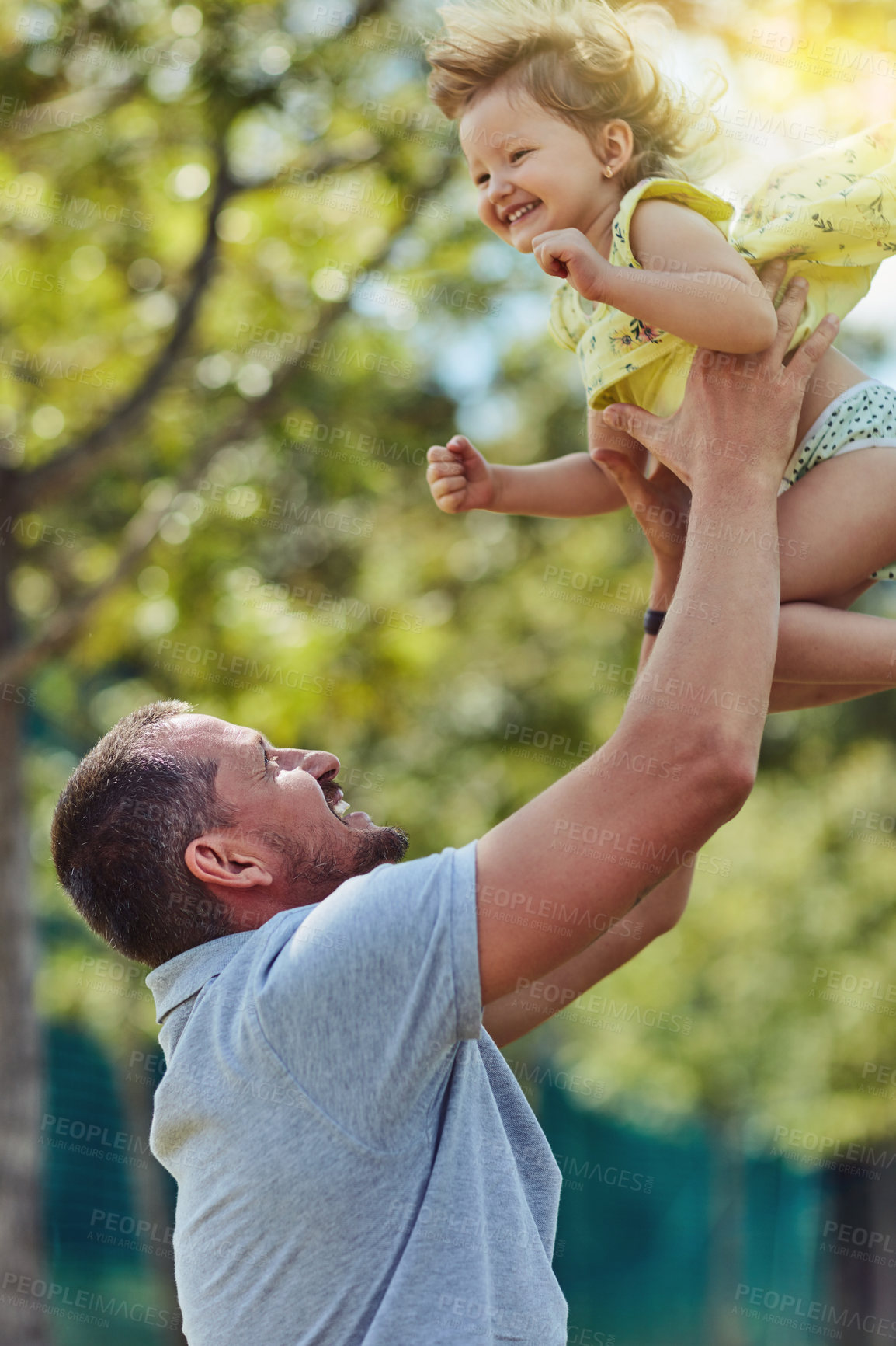 Buy stock photo Happy father, child and lifting with nature for bonding, holiday or weekend together at park. Dad, daughter or little girl with smile for love, care or support in air for fun playing or childhood