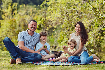 Buy stock photo Happy family, portrait and picnic with children for holiday, weekend or fun day together at park. Mother, father and kids or siblings with smile for bonding, play date or outdoor childhood in nature