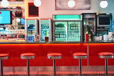 Buy stock photo Retro, vintage and stools with interior in a diner, restaurant or cafeteria with funky decor. Trendy, old school and chairs by a counter or bar in groovy, vibrant and stylish old fashioned empty cafe