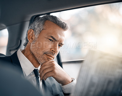 Buy stock photo Man, reading newspaper and car for business travel, journey or drive while thinking of news. Professional male person with media paper in passenger seat for work with luxury transportation or a taxi