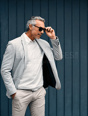 Buy stock photo Cropped shot of a smartly dressed mature businessman standing outside