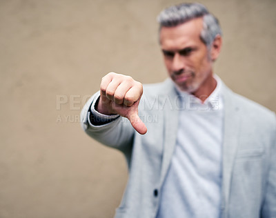 Buy stock photo Hand, business man and thumbs down for fail, bad review or wrong investment outdoor. Dislike sign, gesture and mature manager with negative opinion, vote or feedback emoji closeup on wall background