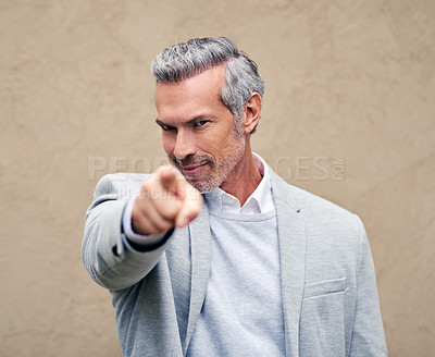 Buy stock photo Cropped shot of a smartly dressed mature businessman pointing outside