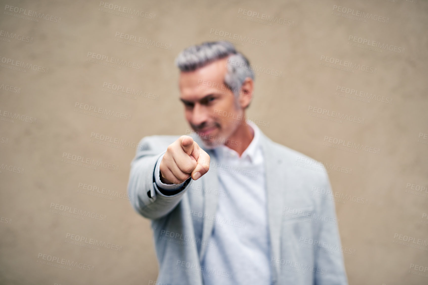 Buy stock photo Cropped shot of a smartly dressed mature businessman pointing outside
