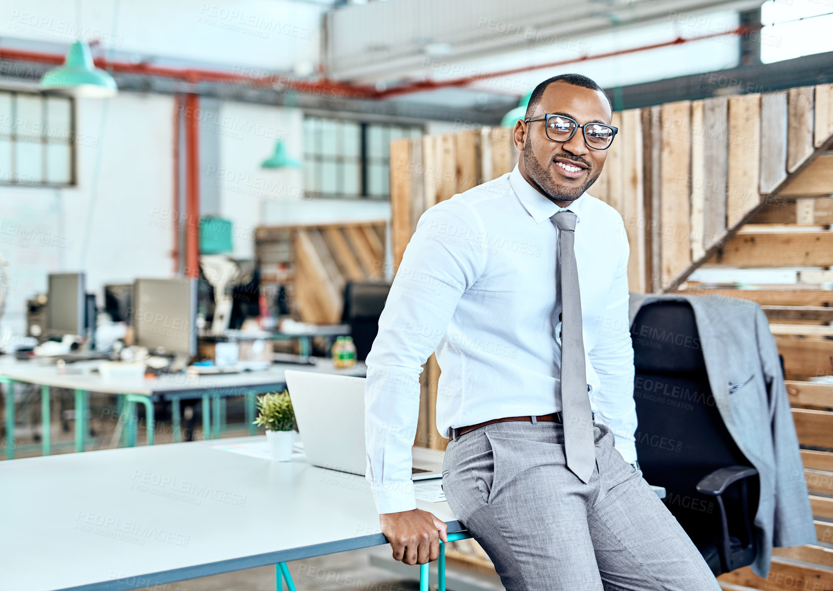 Buy stock photo Portrait of a young businessman standing in an office