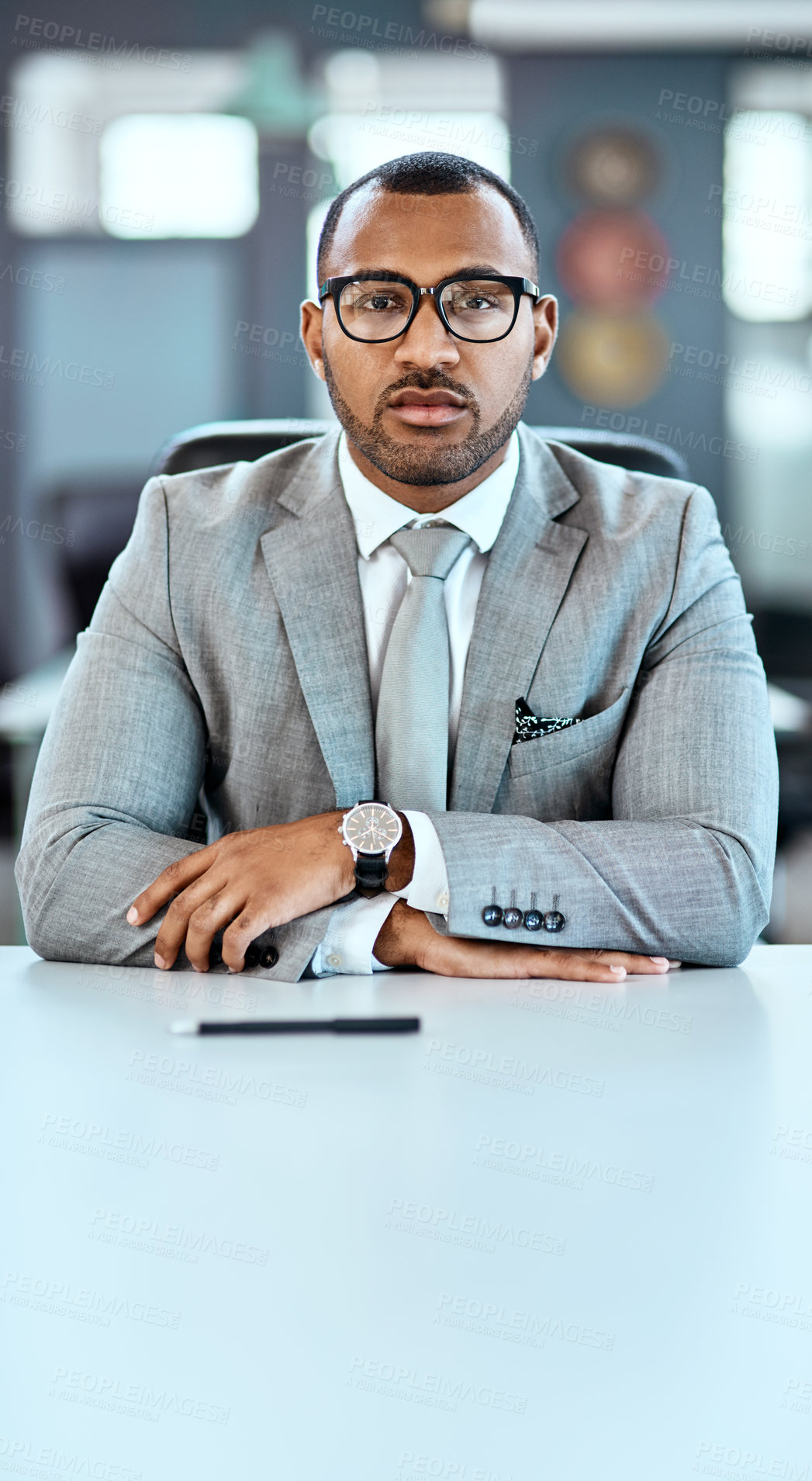 Buy stock photo Portrait of a young businessman sitting in an office