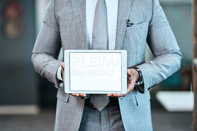 Buy stock photo Closeup shot of an unrecognizable businessman holding up a digital tablet with a blank screen in an office