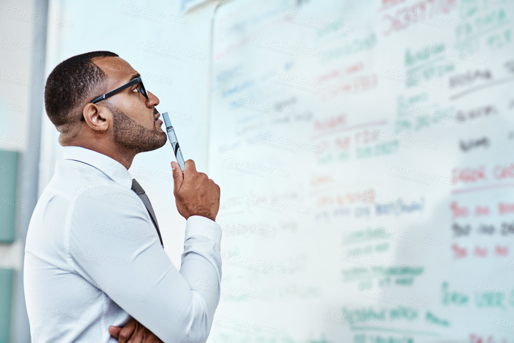 Buy stock photo Thinking, planning and business man on whiteboard brainstorming, ideas and information or problem solving. Professional African person or corporate worker reading, solution and project notes on board