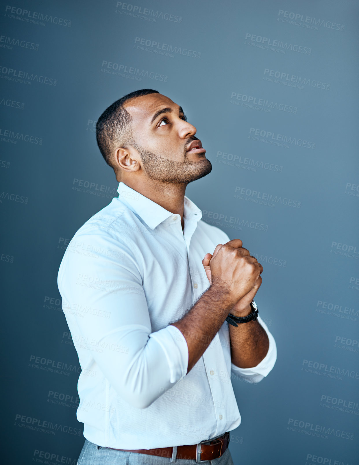 Buy stock photo Business, black man and praying in studio with anxiety for news, results or promotion or feedback. Prayer, hope and nervous guy model with emoji for good luck, outcome or review on gray background