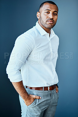 Buy stock photo Studio portrait of a young businessman standing against a grey background