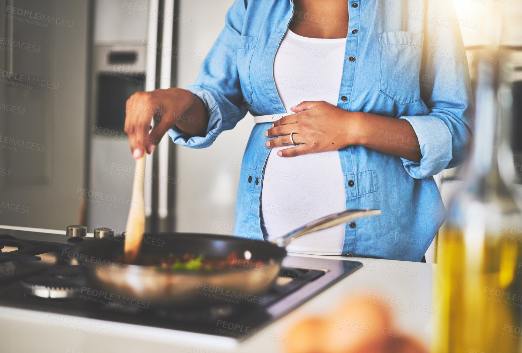 Buy stock photo Maternity, cooking and woman in kitchen in home for healthy, wellness and diet meal with nutrition. Pregnant, pasta and female person preparing food for dinner, supper or lunch for pregnancy benefits