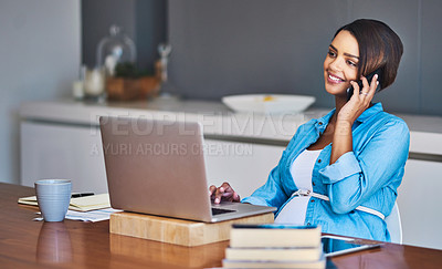 Buy stock photo Shot of a pregnant young woman using a laptop and mobile phone while working from home