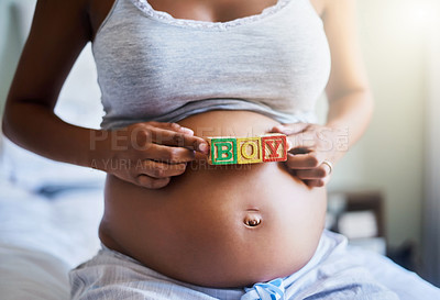Buy stock photo Cropped shot of a pregnant woman with wooden blocks on her belly that spell the word boy