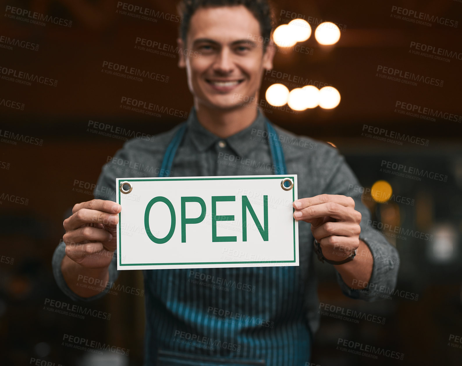 Buy stock photo Portrait of a cheerful young businessman holding up a sign saying 
